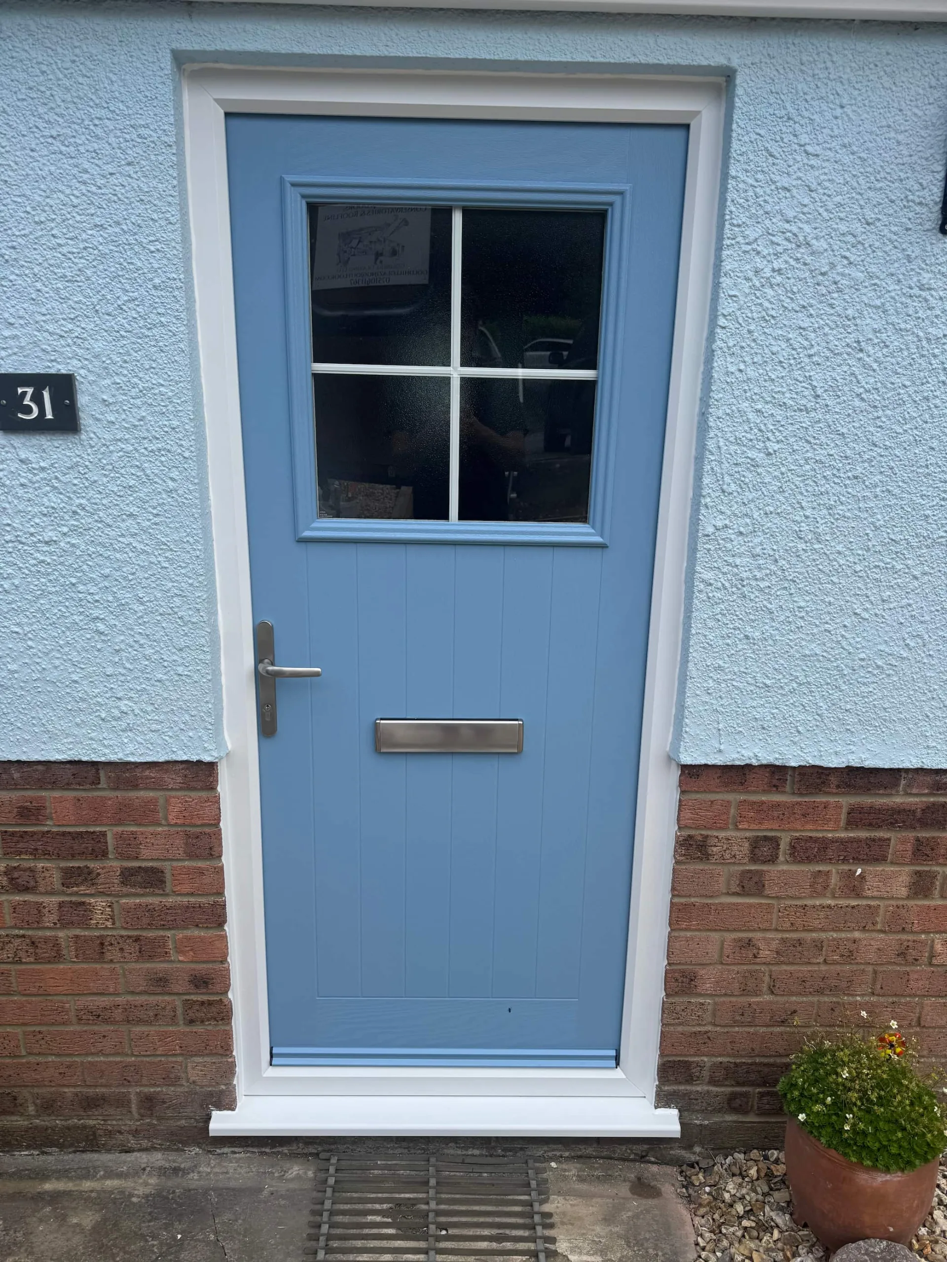 Duck egg blue composite door for a home in Sherborne.
