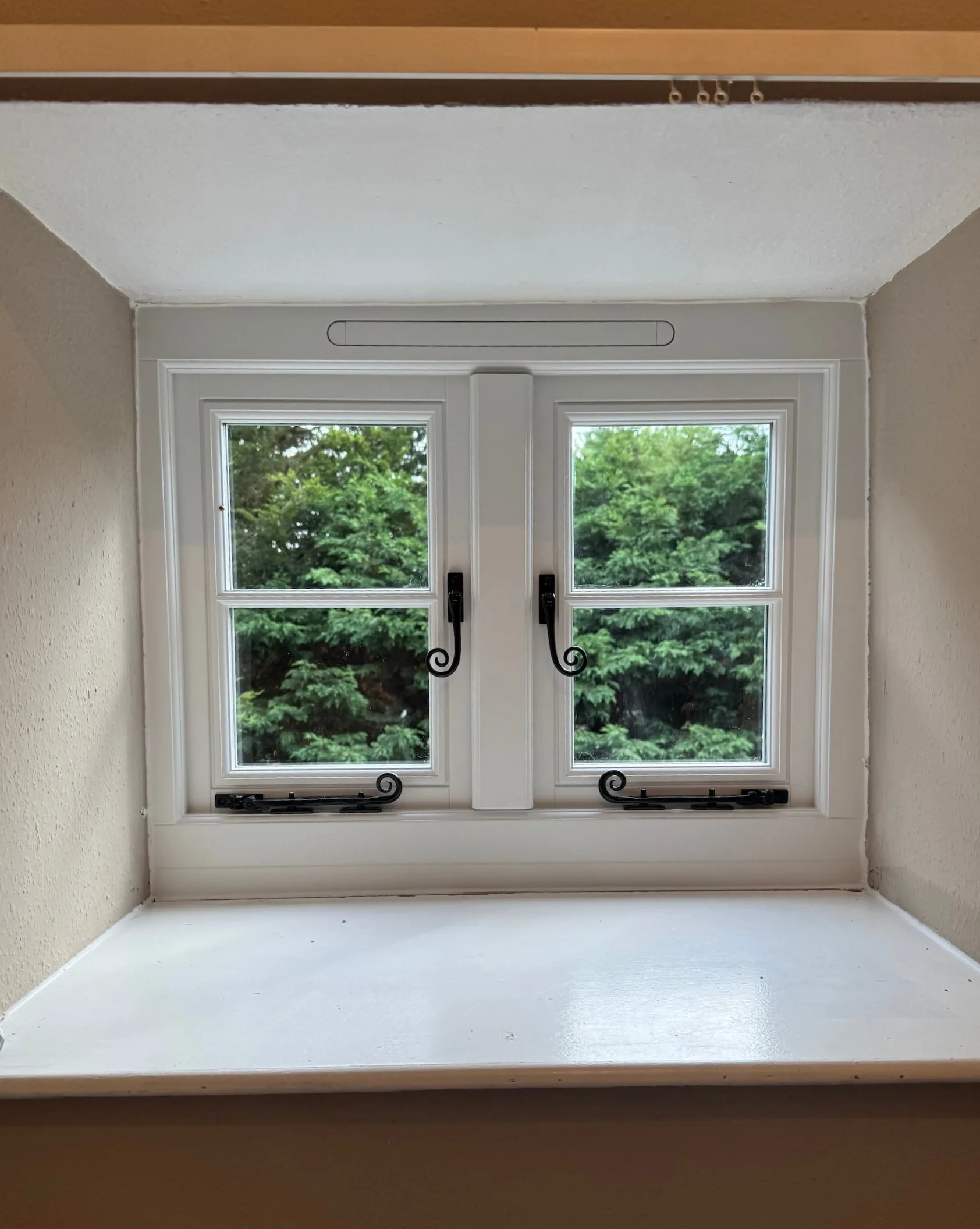 A timber window with monkey tail handles in Salisbury.