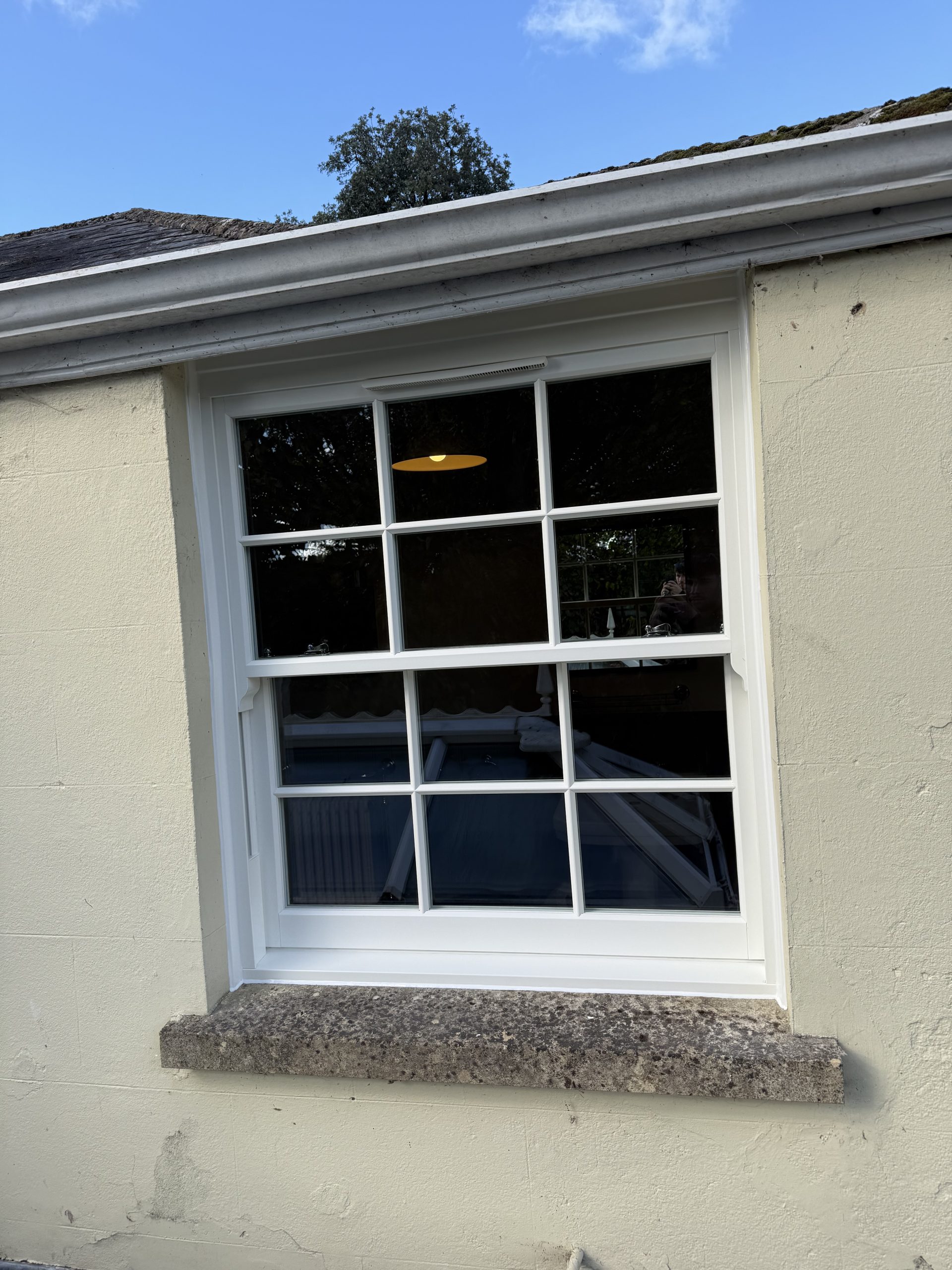 White Roseview Ultimate Rose sliding sash window with Georgian bars, fitted in Sturminster Marshall, Dorset