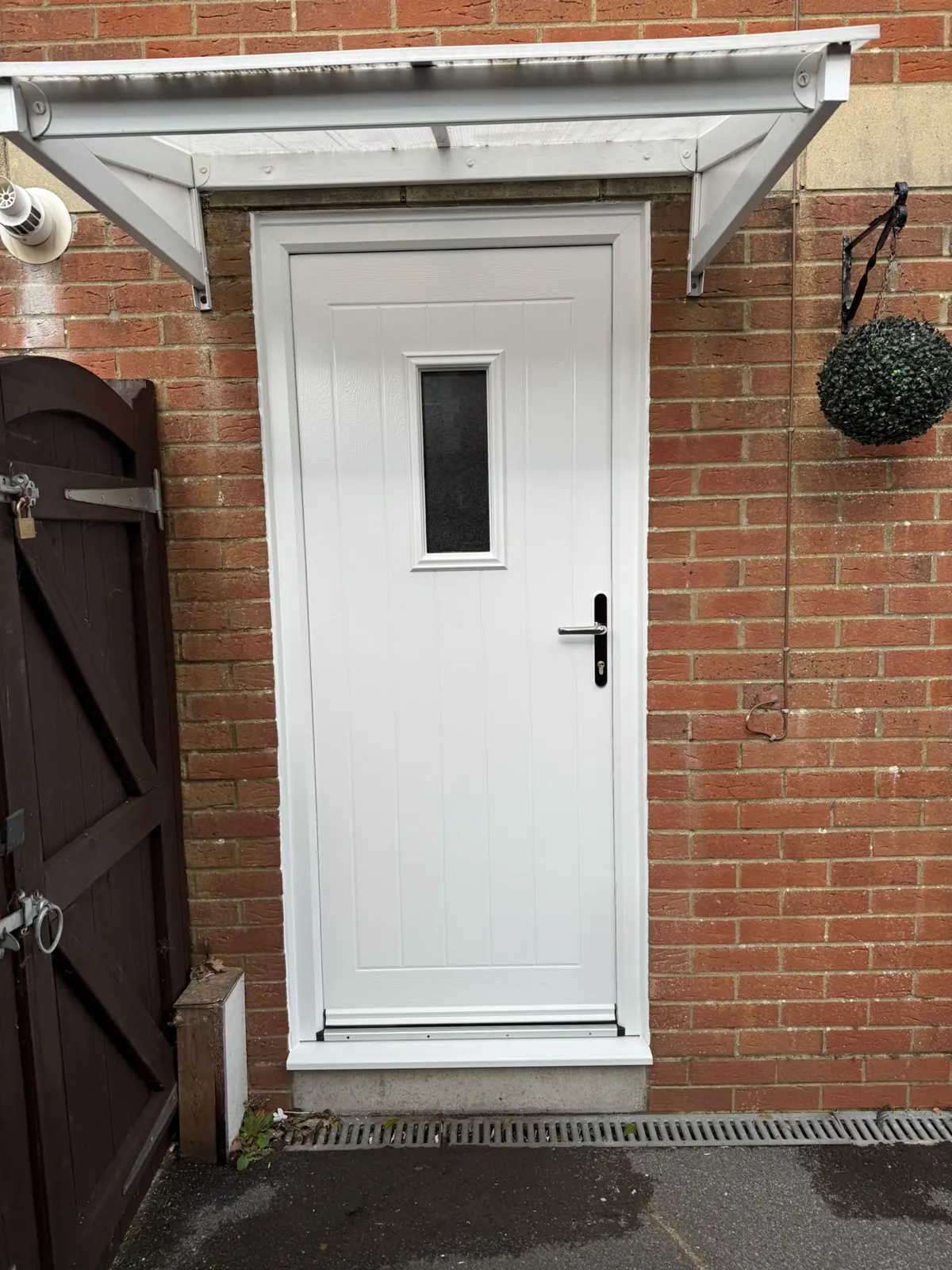 White solid core composite door with a cottage-style boarded design, fitted in Gillingham
